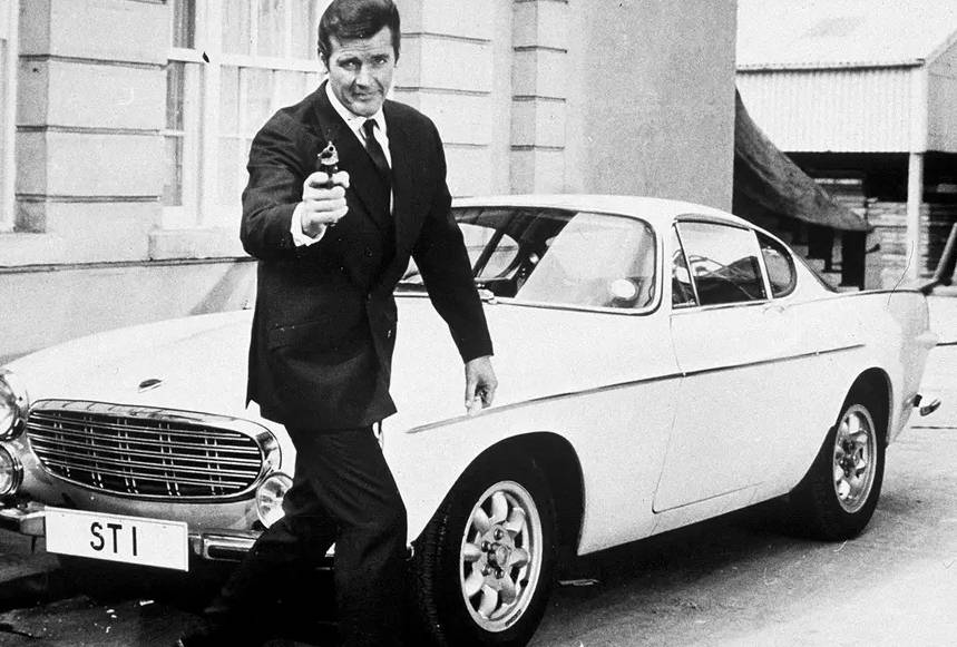 Roger Moore as Simon Templer in The Saint and Volvo P1800 S coupe